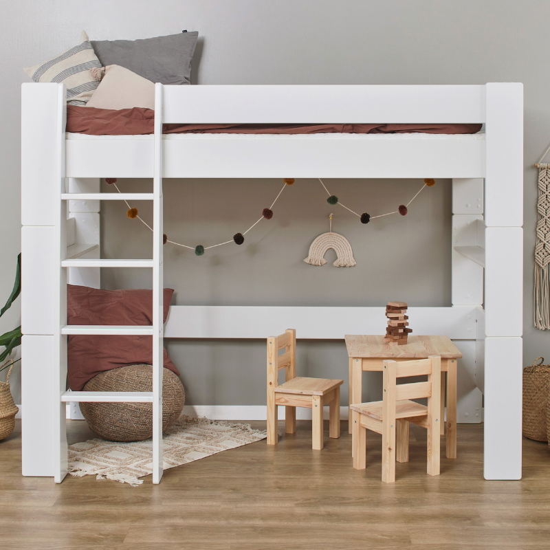 White loft bed with wooden floor and furniture in a room setting